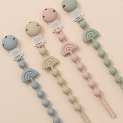 Clipe de chupeta em silicone – design arco-íris com relevo sensorial