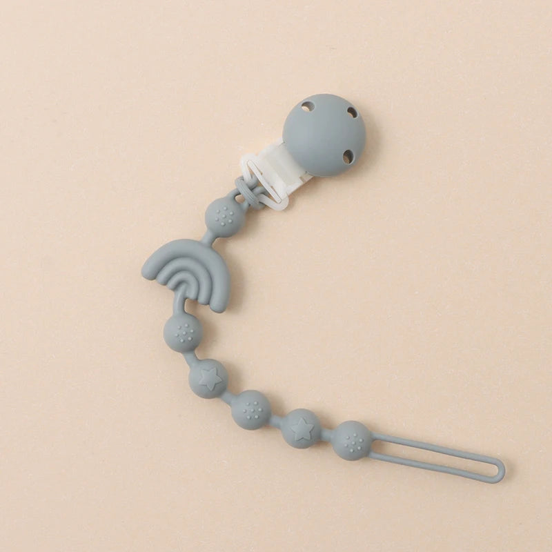 Clipe de chupeta em silicone – design arco-íris com relevo sensorial