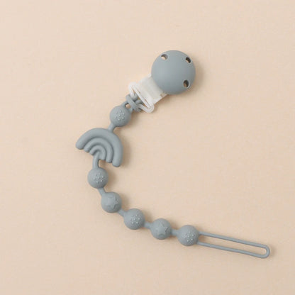 Clipe de chupeta em silicone – design arco-íris com relevo sensorial